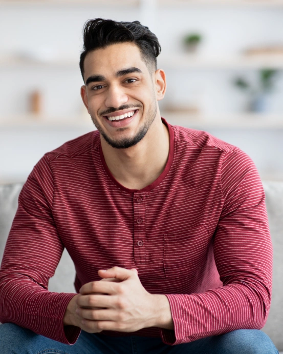 Smiling patient representing restorative dental treatment